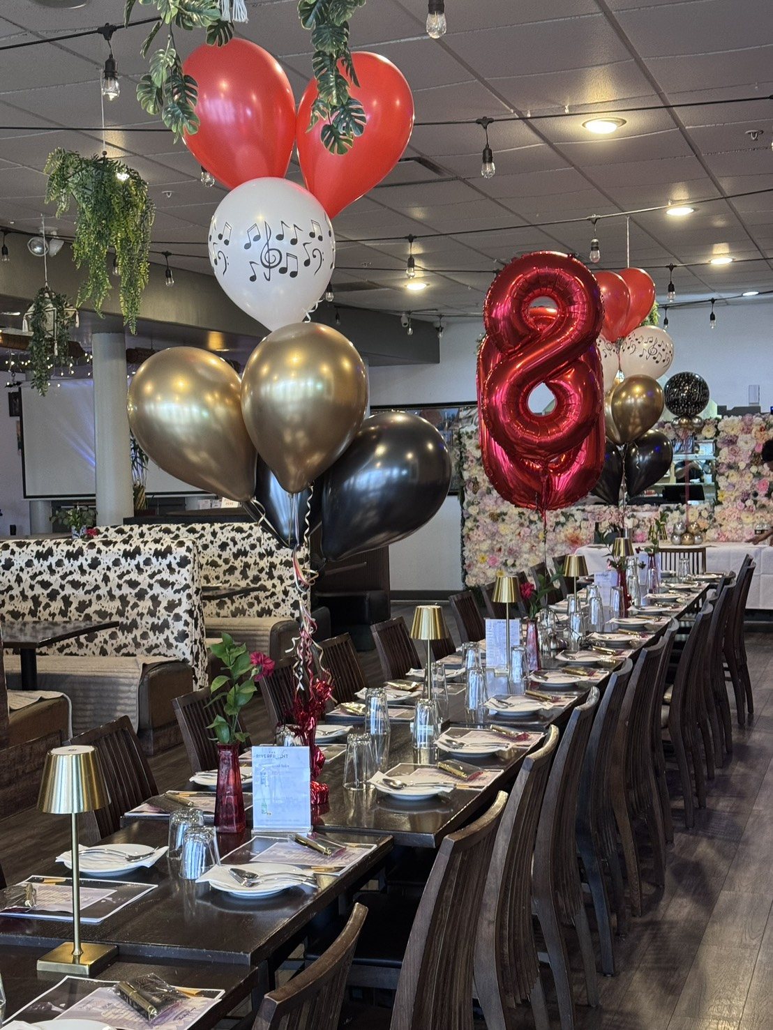 Birthday balloons over the tables